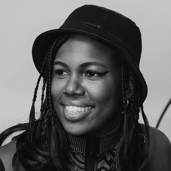 Leanne at a mic, smiling