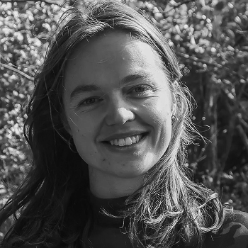 Marnie Woodmeade, in bright sunlight, smiling at the camera